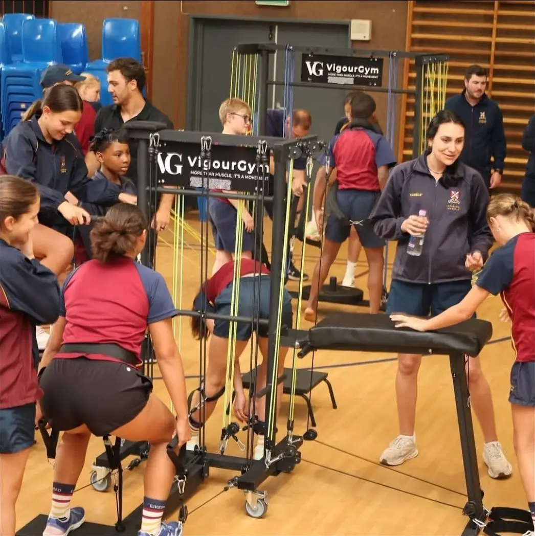 Staff supporting participants during a VigourGym session